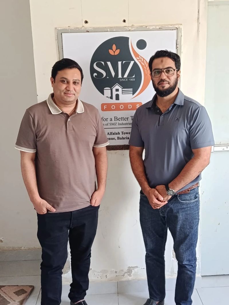A Tti Labs representative with a client at SMZ Foods