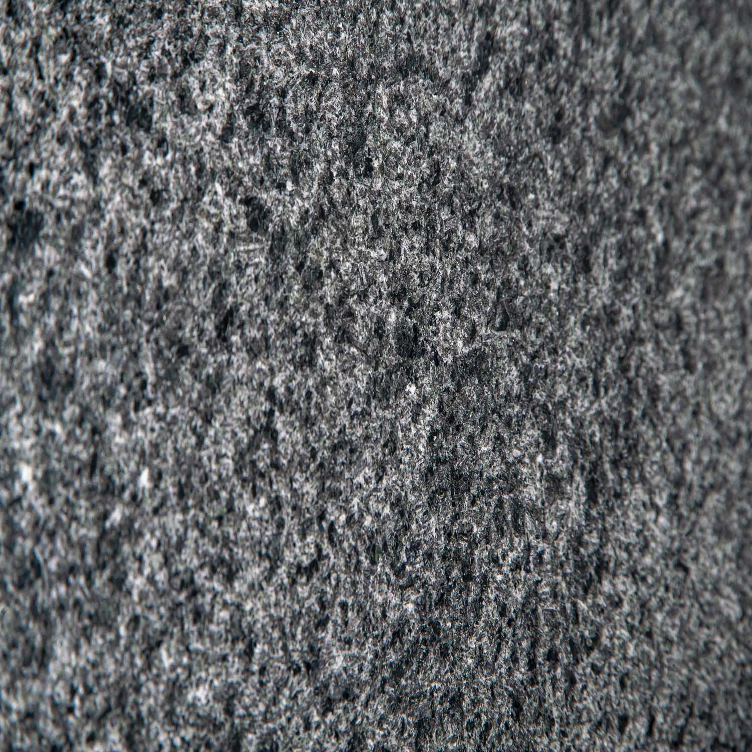 Granitstruktur mit grauen und weißen Punkten