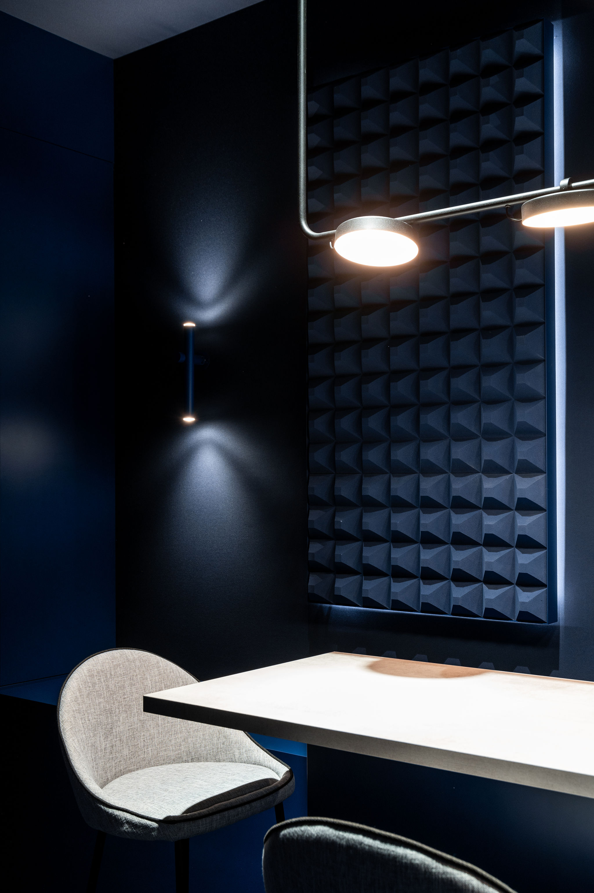 Estiluz wall lamp and chandelier of the H. Moser & Cie design retail and creative  concept booth for the Watches and Wonders fair 2024 