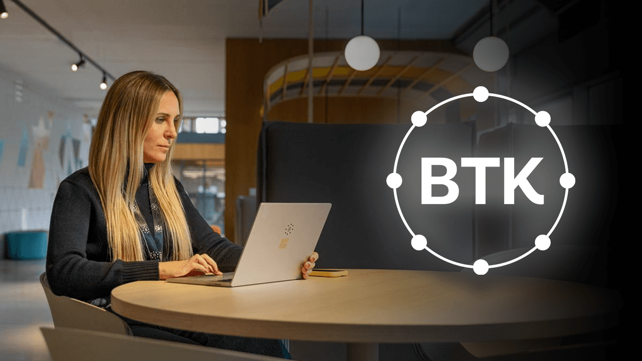 CEO of the BeToken project sitting in front of the laptop in the office in Barcelona