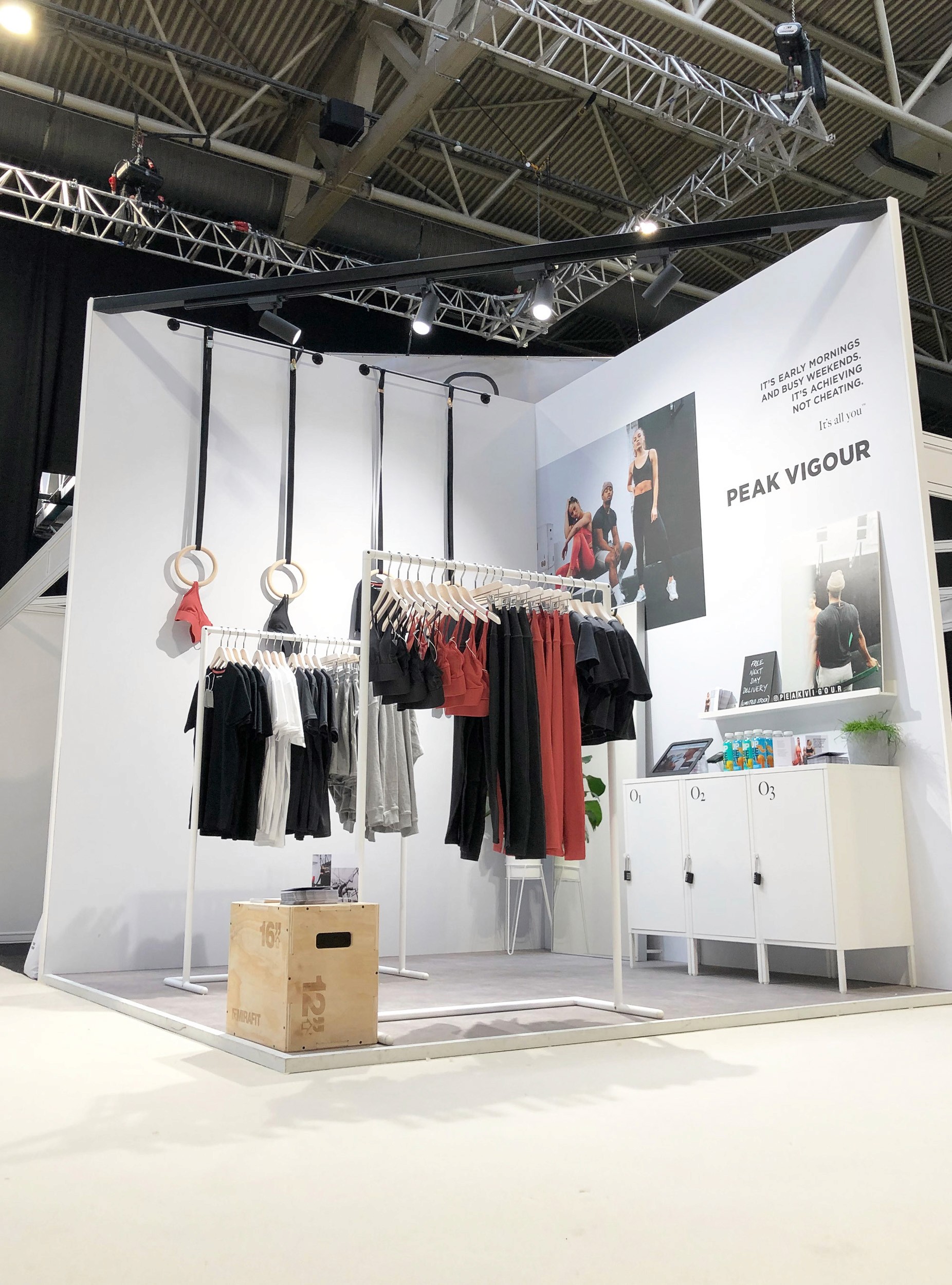 Peak Vigour activewear displayed for event, event stand