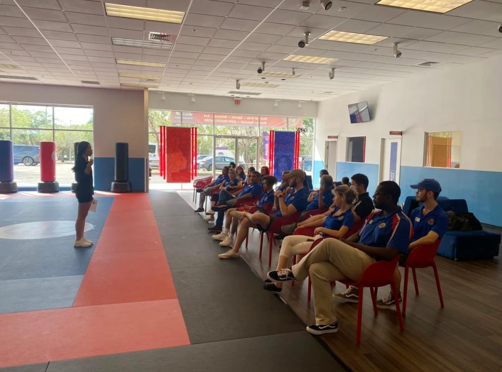 Team members sitting listening to a presentation.