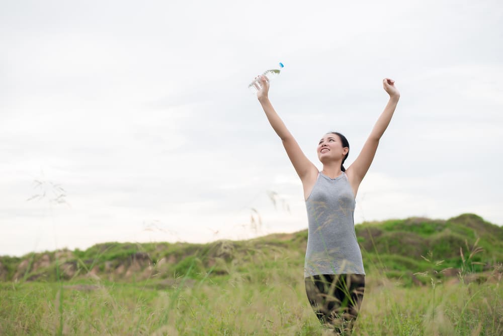 woman raising her hands