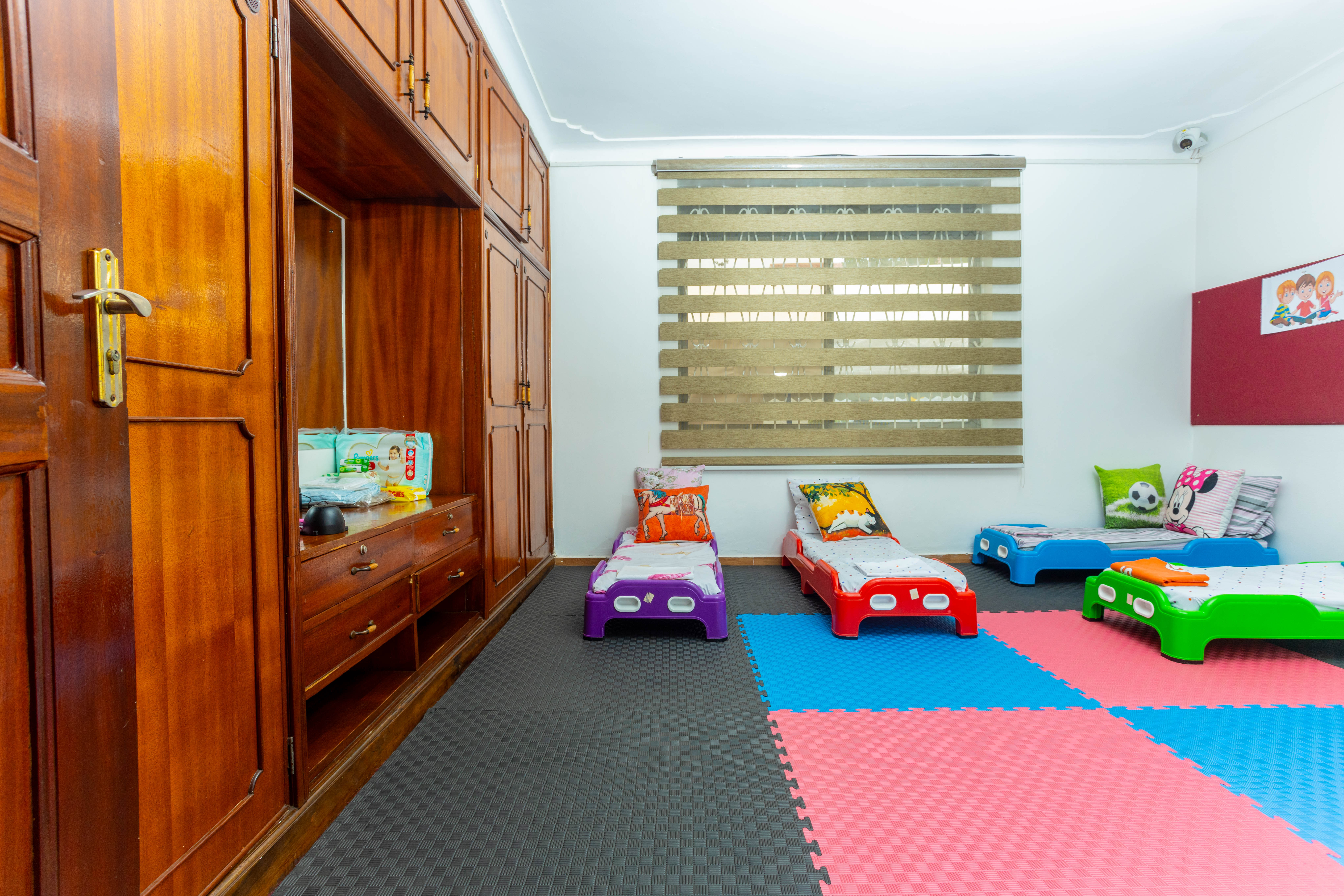 A mother and her son are sitting together, using a tablet to work on homework