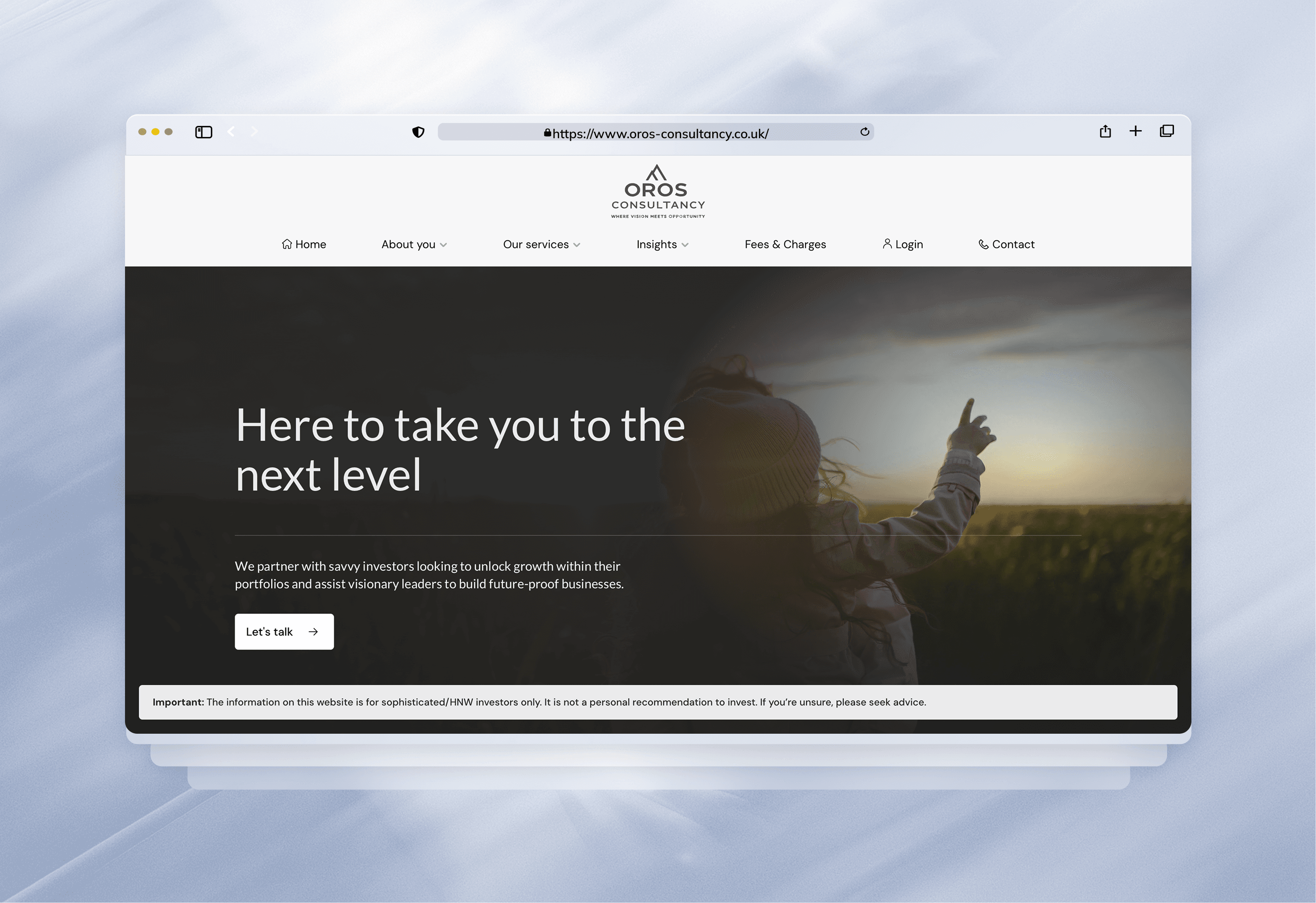 Palm trees frame a dramatic mountain valley landscape