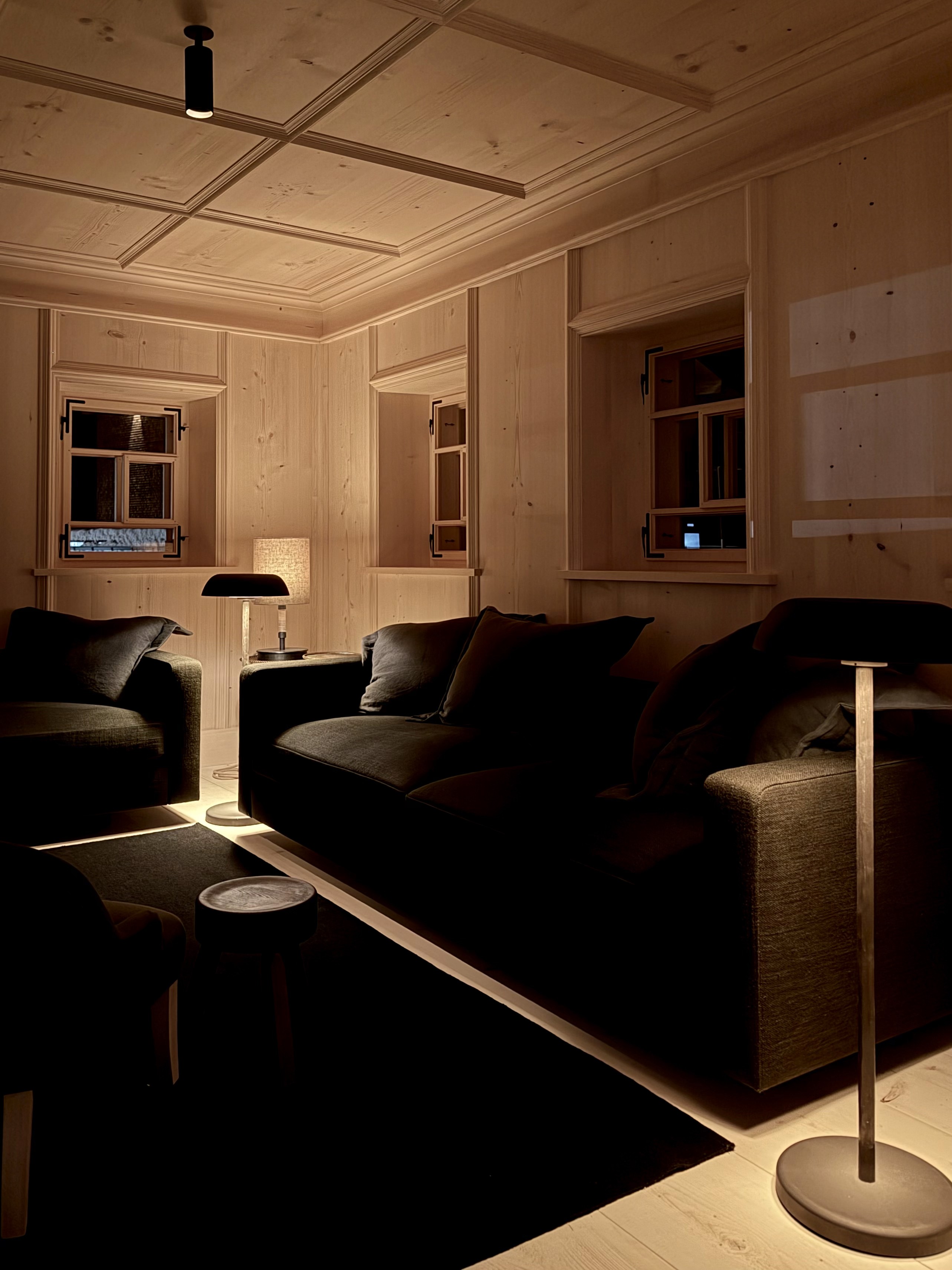 bedroom of the Haus W chalet looking out onto a snowy mountain.