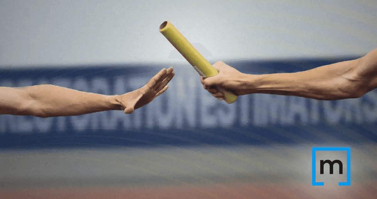 arm of two athletes running a relay race