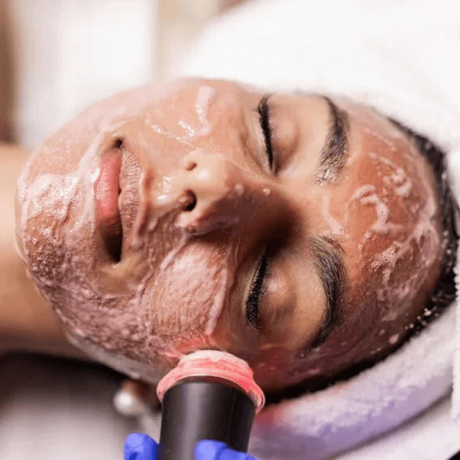 A woman getting a Glo2Facial at a spa