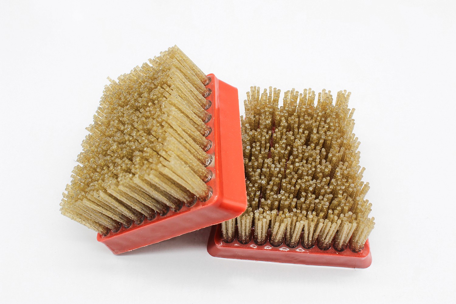 Two diamond abrasive brushes positioned at different angles to display various aspects of the product.