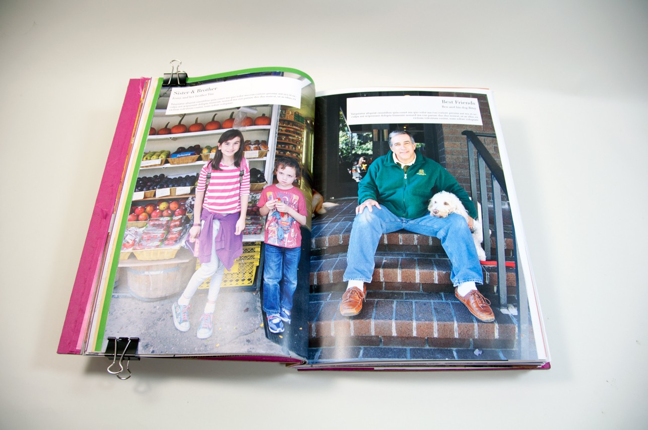 an opened book depicting a picture of two kids on the left and an older person sitting on the stairs on the porch on the right side