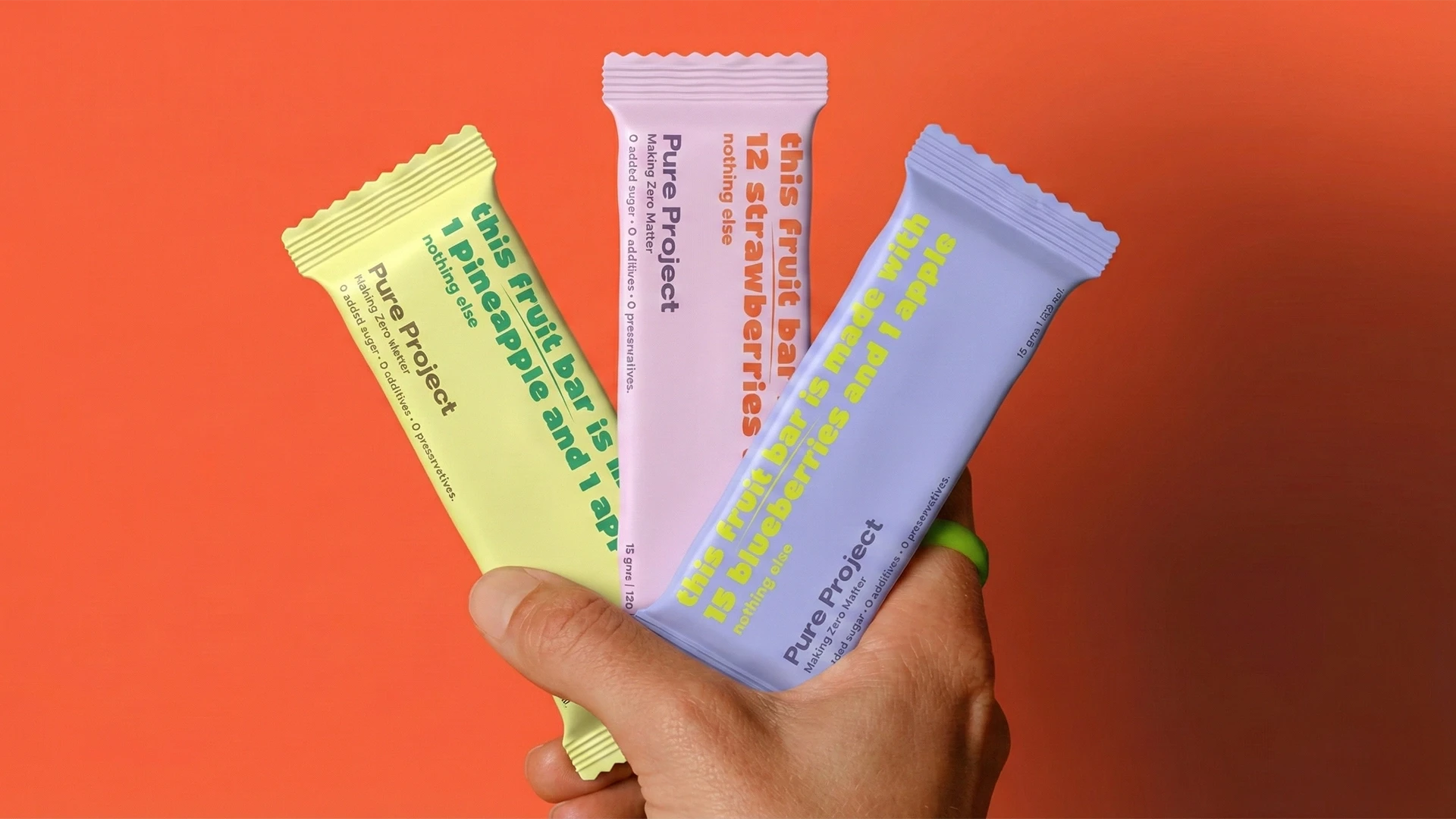On-the-go lifestyle shot of Pure Project all-natural fruit bars
