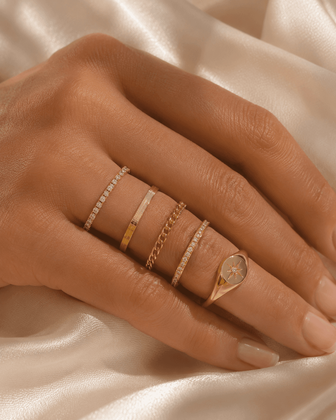 Fine gold chain jewelry on soft textile