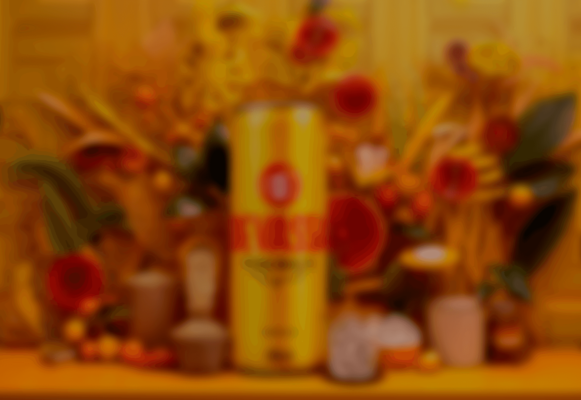 Blurred silhouette of a person standing by a window with red-tinted light and plants