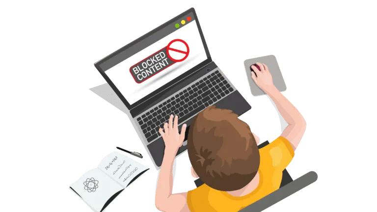 A child using a laptop with a "Blocked Content" message on the laptop screen.