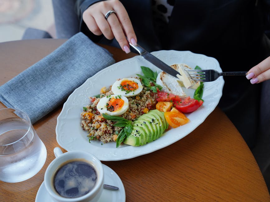 A balanced meal plate with protein, vegetables, whole grains, and healthy fats.