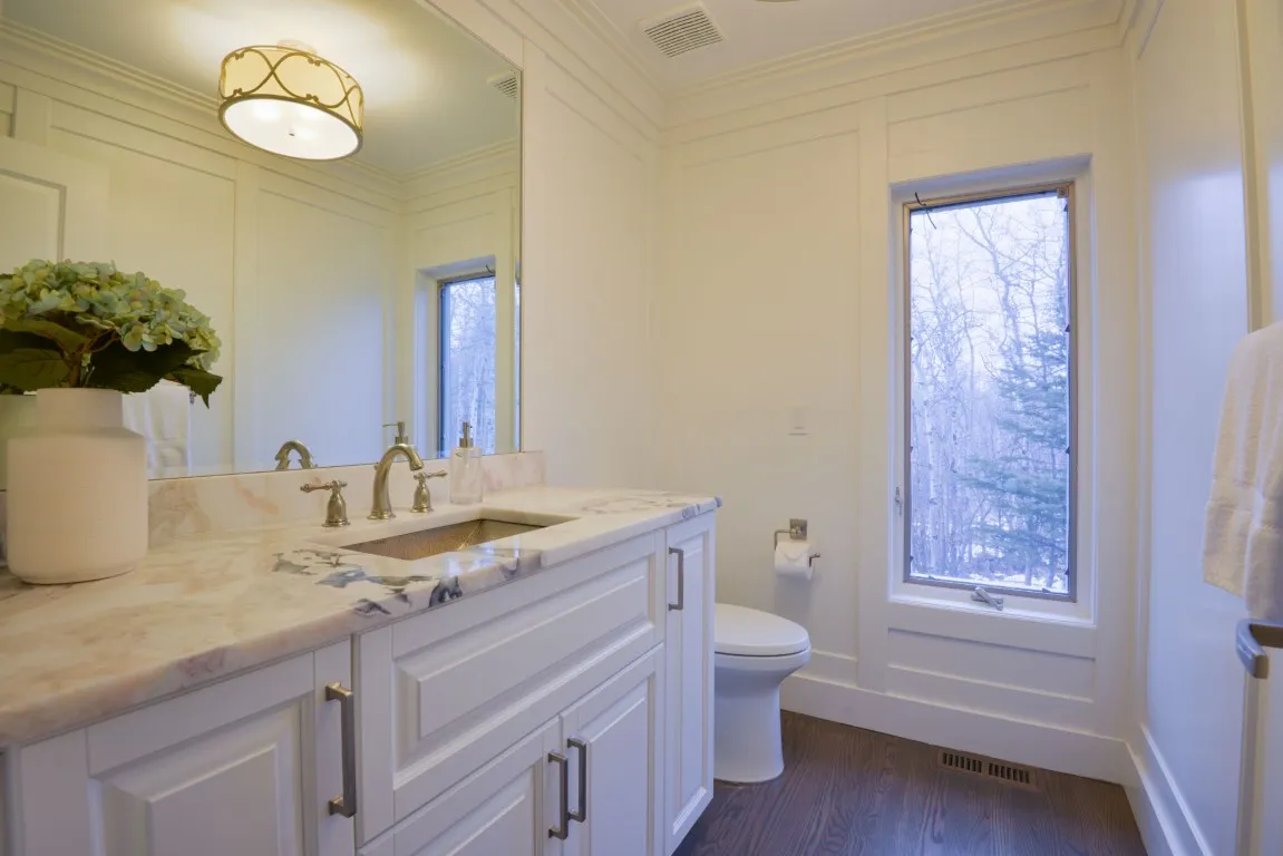Image of "KHD Homes luxurious primary ensuite bathroom with marble countertops, elegant fixtures, and spa-like ambiance."