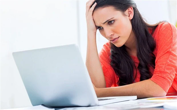 Stressed woman in front of computer