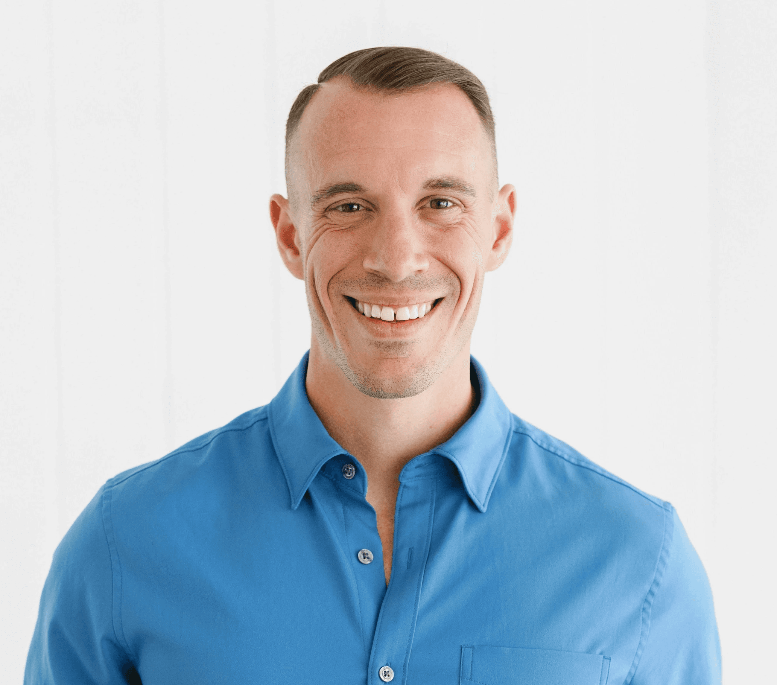 A happy customer smiling wearing orange headband