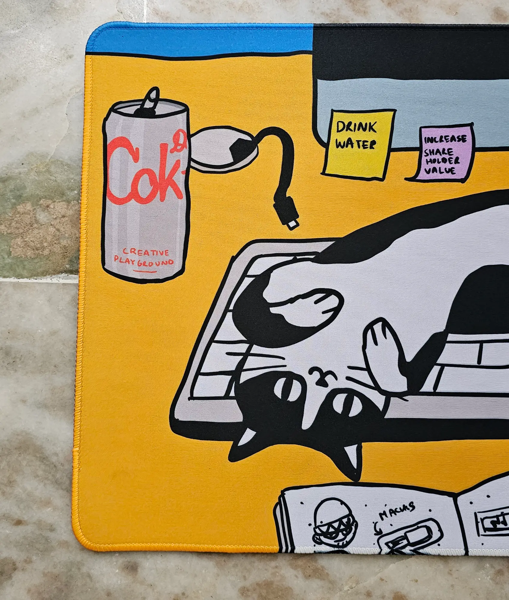 Desk Cat deskmat close-up: the soda can and the sleeping cat