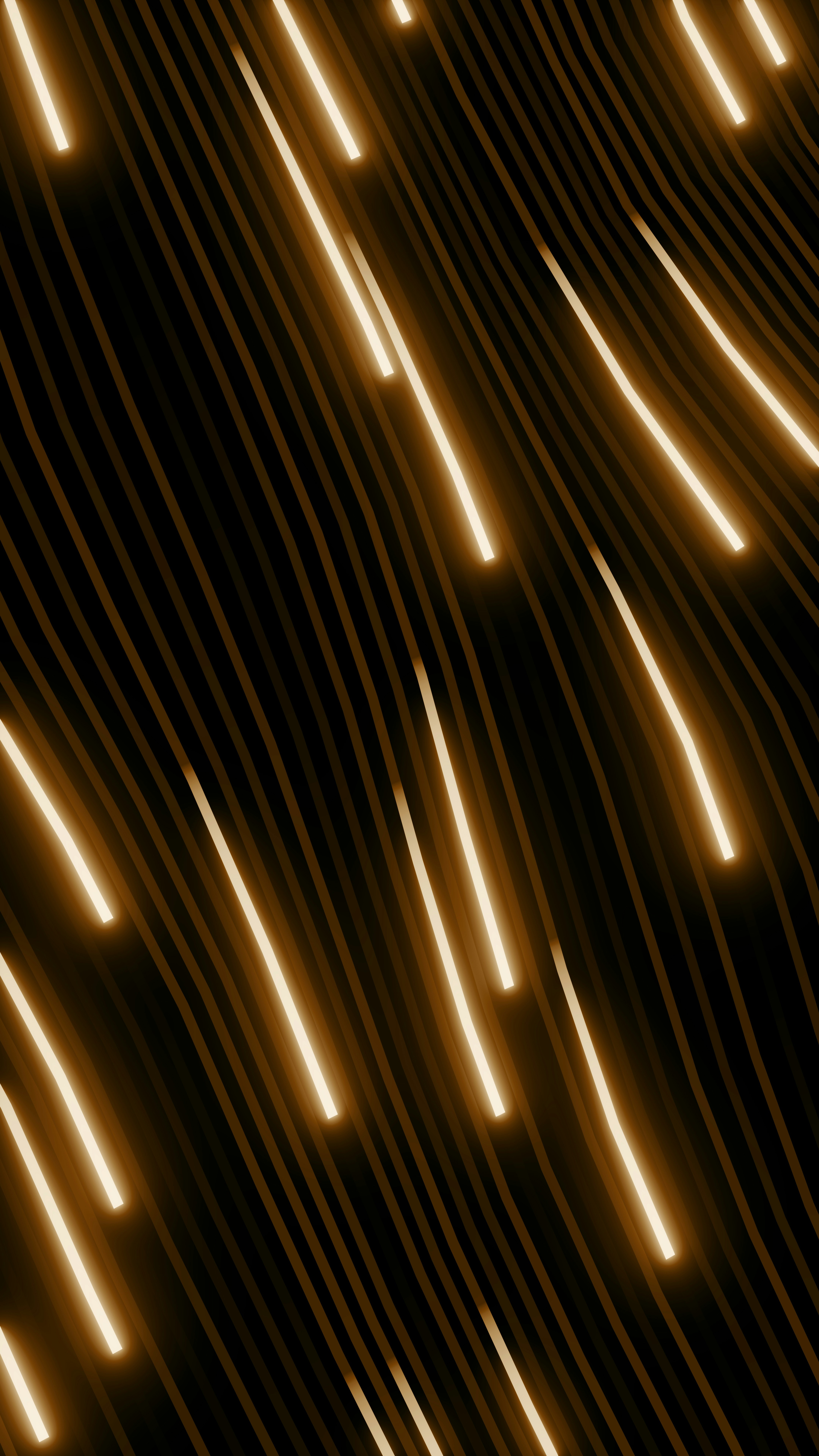 A smiling woman with her arms crossed, standing against a dark green background. She has long, dark hair.