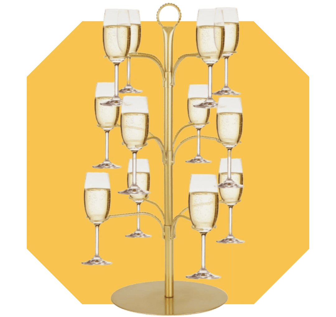 Image of a gold champagne glass tree with an irregular image in the background.