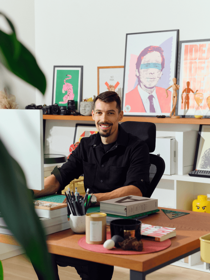 Photo of Luboš at his desk.