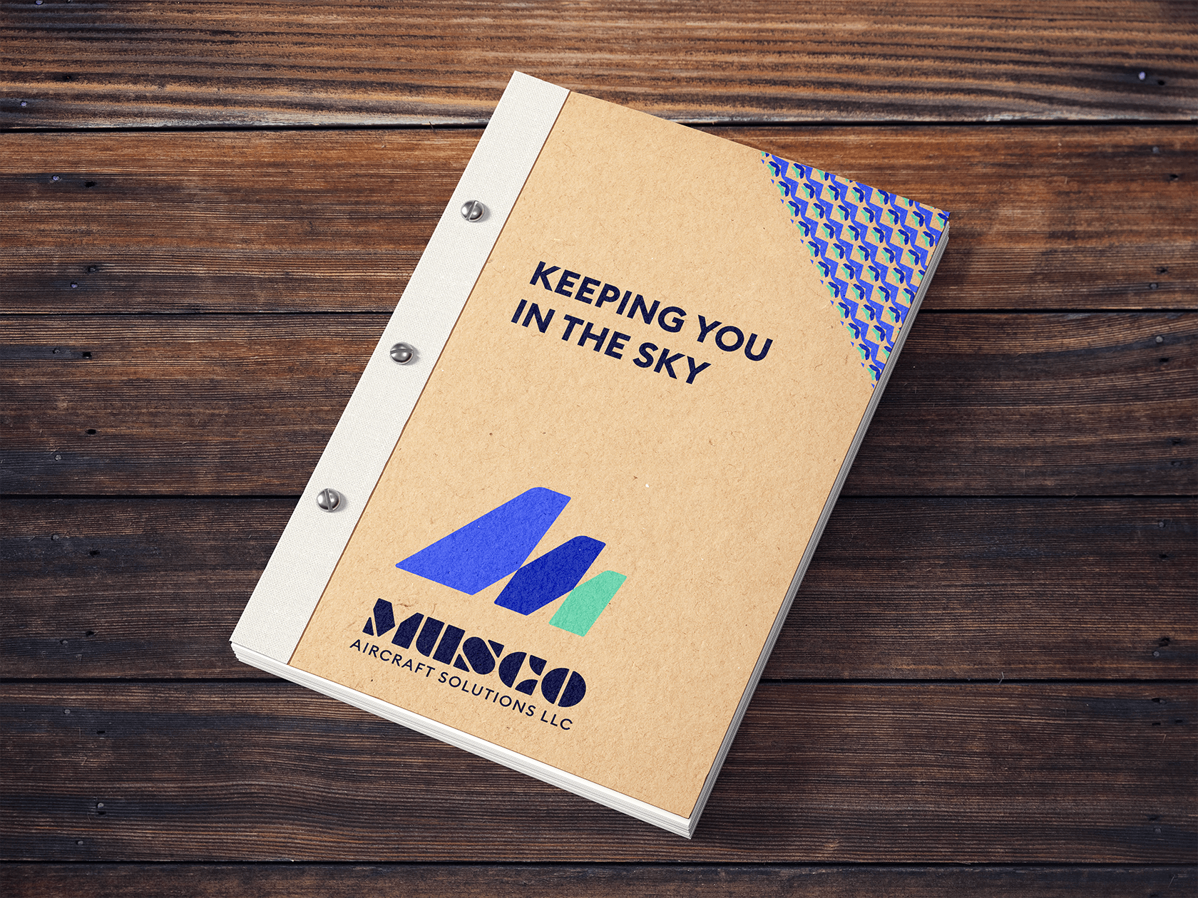 Graphic design mockup of an engineering notebook for Musco Aircraft Solutions — modern, geometric wordmark logo with a clean brandmark with a clean sans serif typography, designed by Will Lefkovich.