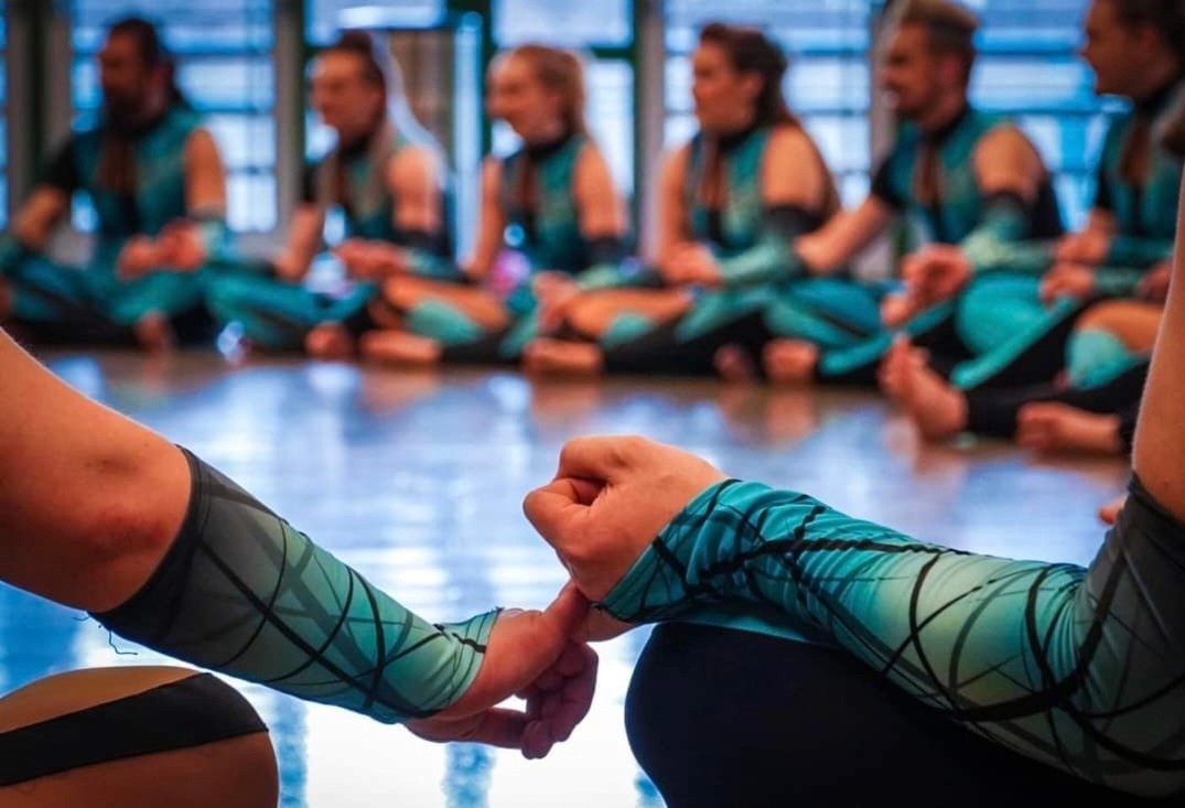 A Juxtaposition choreogrspher smiling teaching a clinic lesson.