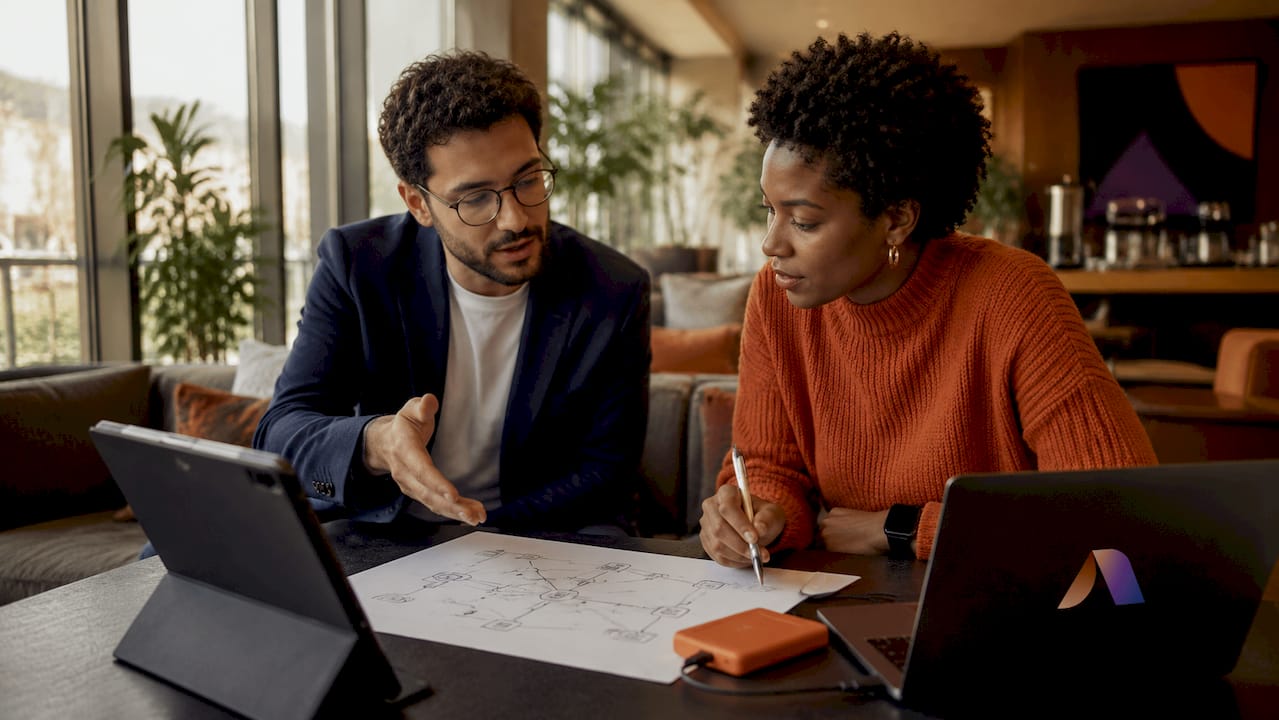 IT professionals discussing hospitality AI systems