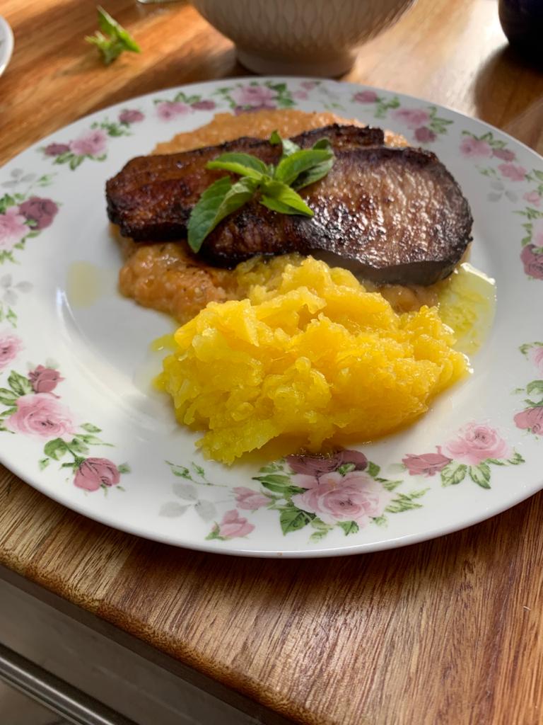 Meat and mashed squash in a plate on a table at Somerset View Guest House.