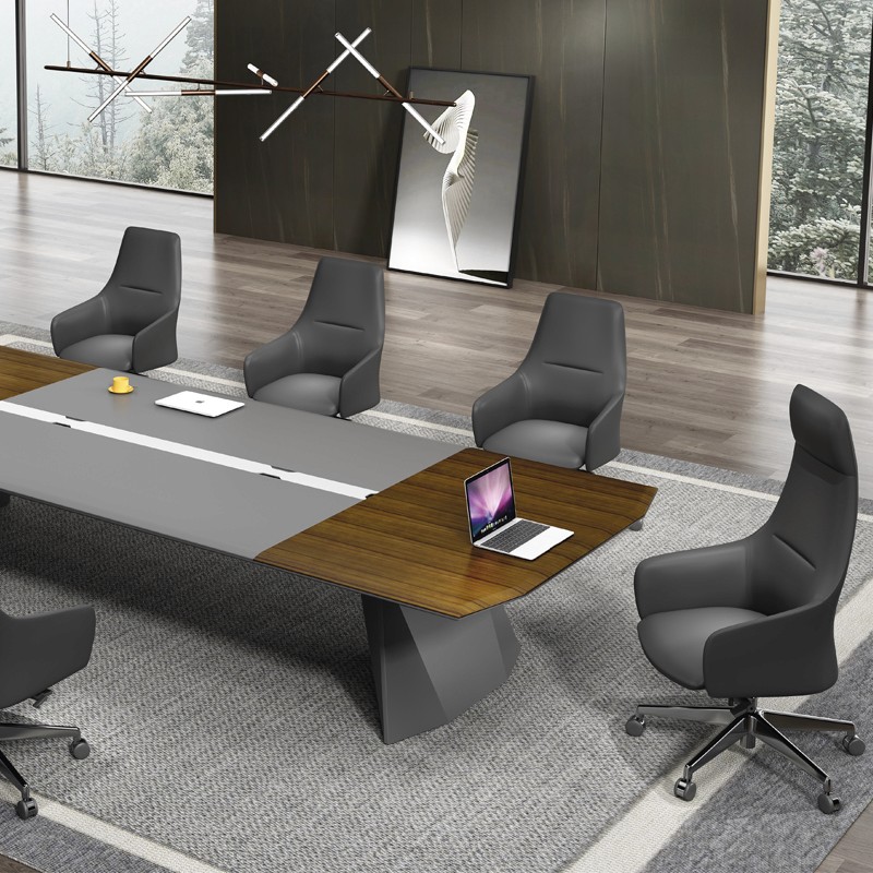 Luxury boardroom featuring charcoal gray Genuine Leather executive and staff chairs around a modern wood and gray conference table in a high-end office setting.