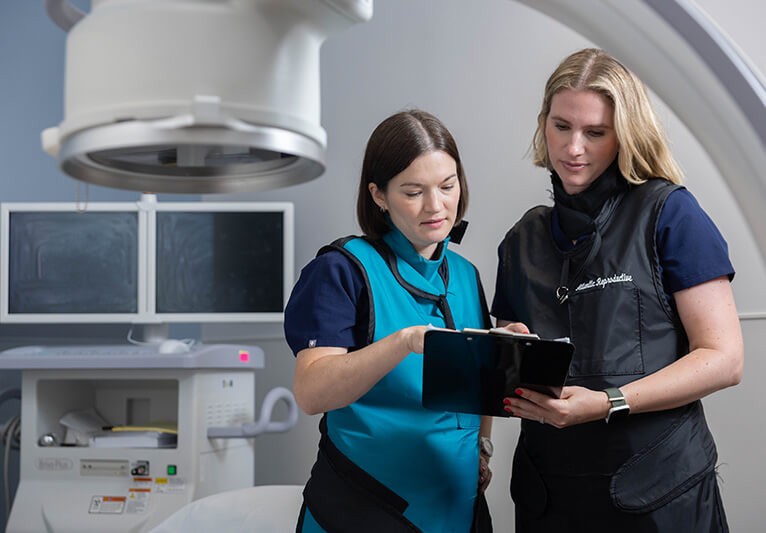 Atlantic staff looking over records