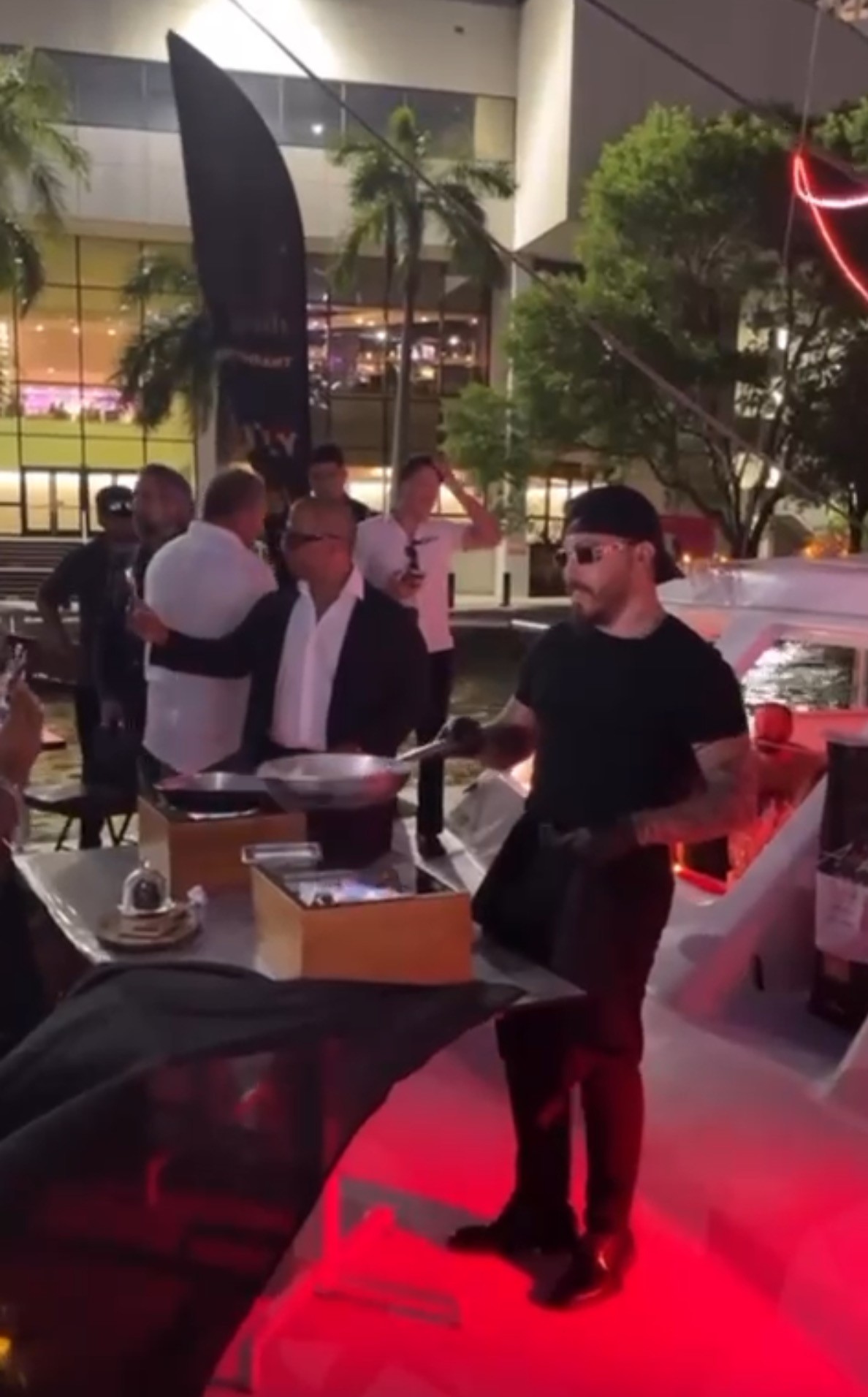 brown wooden folding chairs on green grass field near body of water during daytime