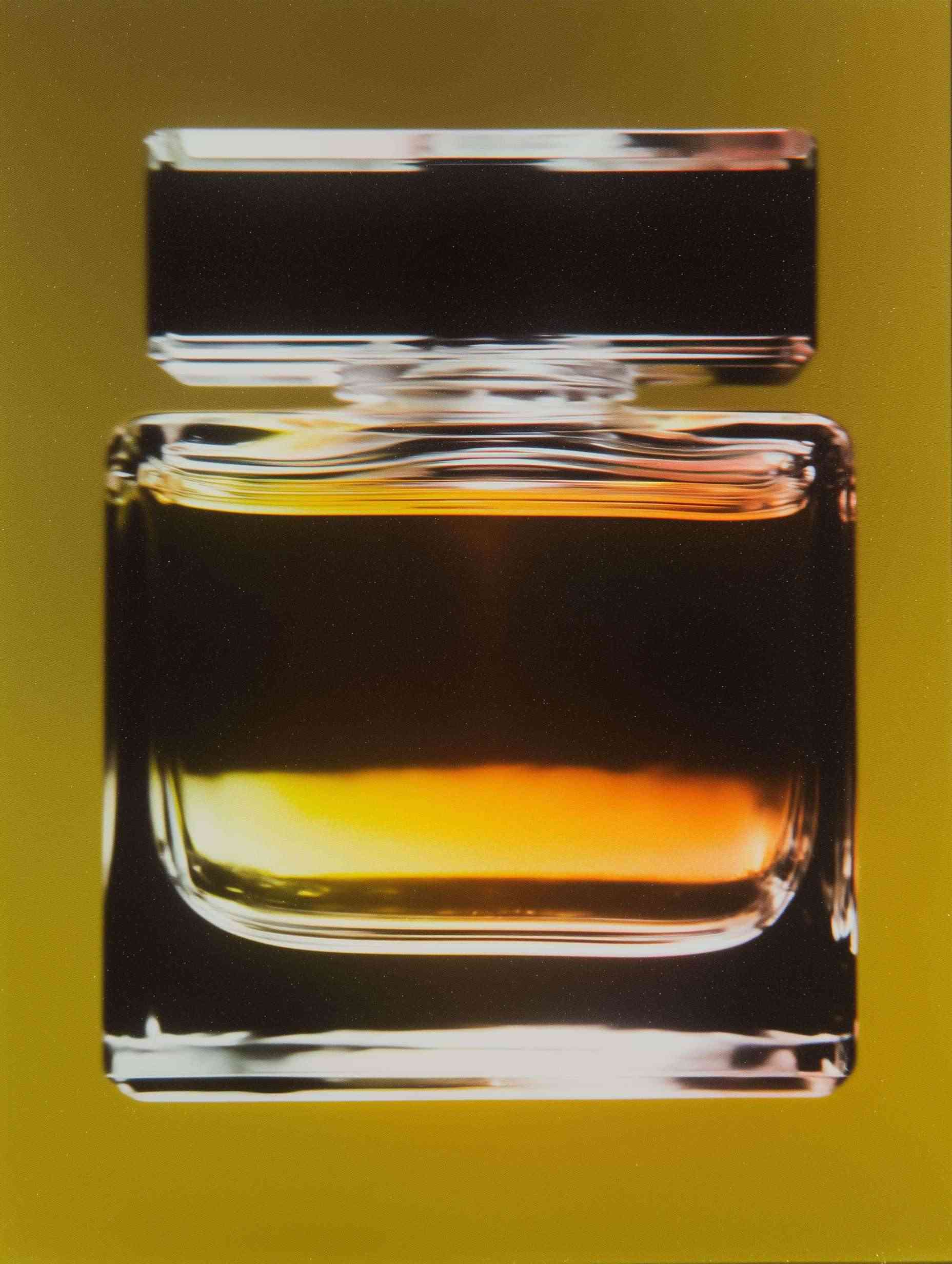 Sparkling golden oil bubbles in water in close-up