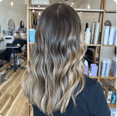 Lived-in brunette to blonde color melt by Stephanie Koontz at Del Sol Hair Studio Huntington Beach
