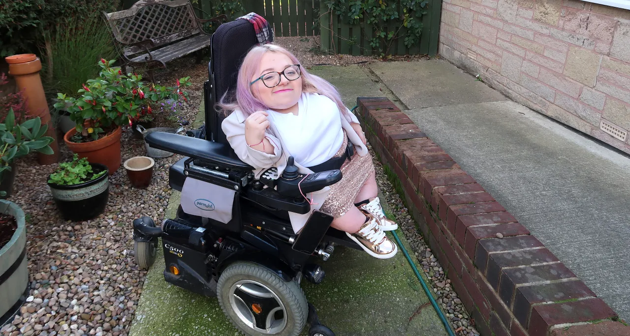 Gem smiling in wheelchair