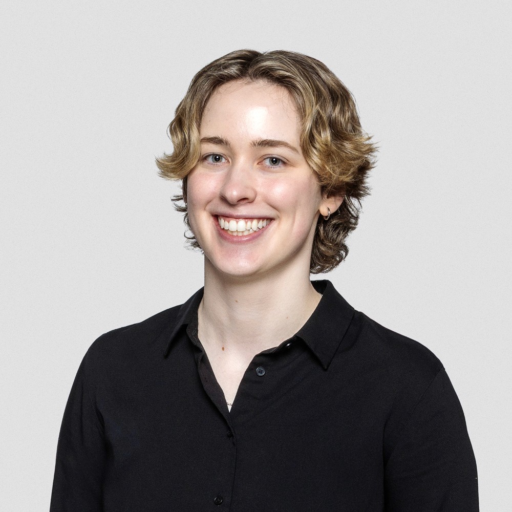 a person wearing a black button up