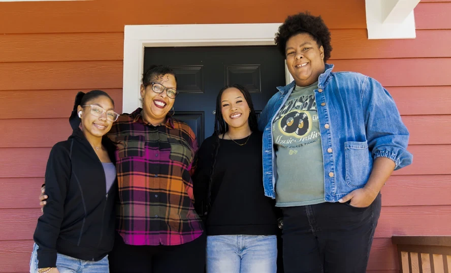 Magenta and her family pictured at their new home in the report