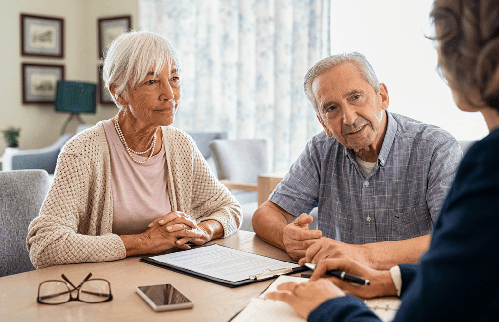 A doctor carefully examining an elderly patient in a hospital room, providing attentive medical care.