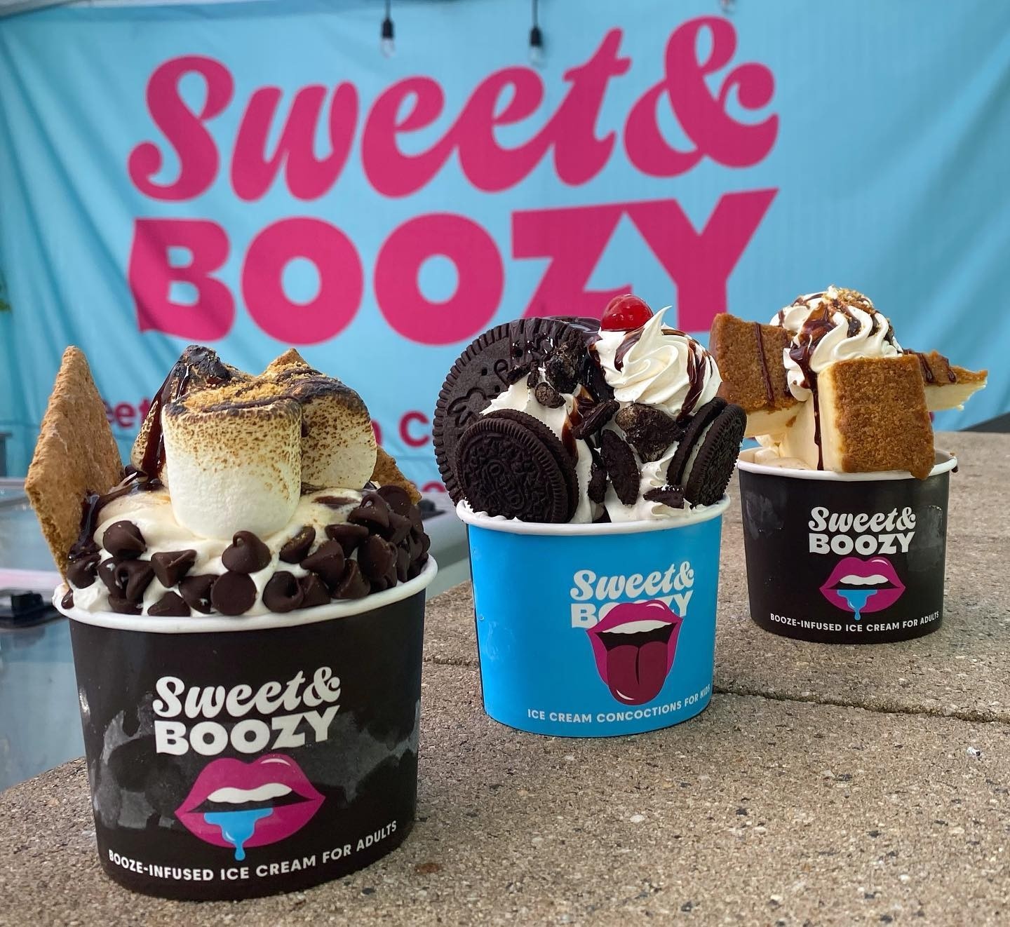 Sweet & Boozy icecream and thundercups in from of Sweet & Boozy Logo banner