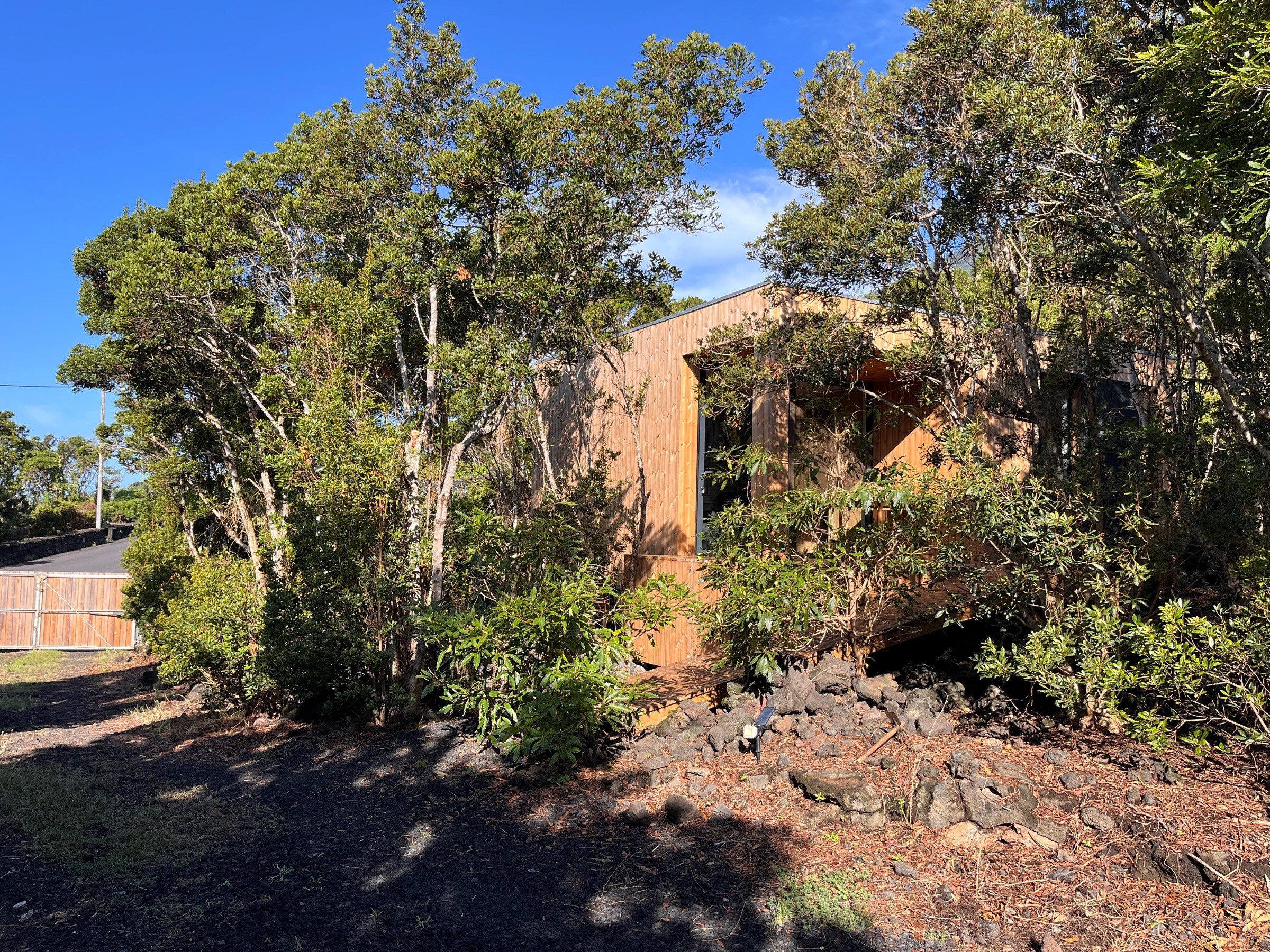 View of the lodge from the driveway, with the access road in the background