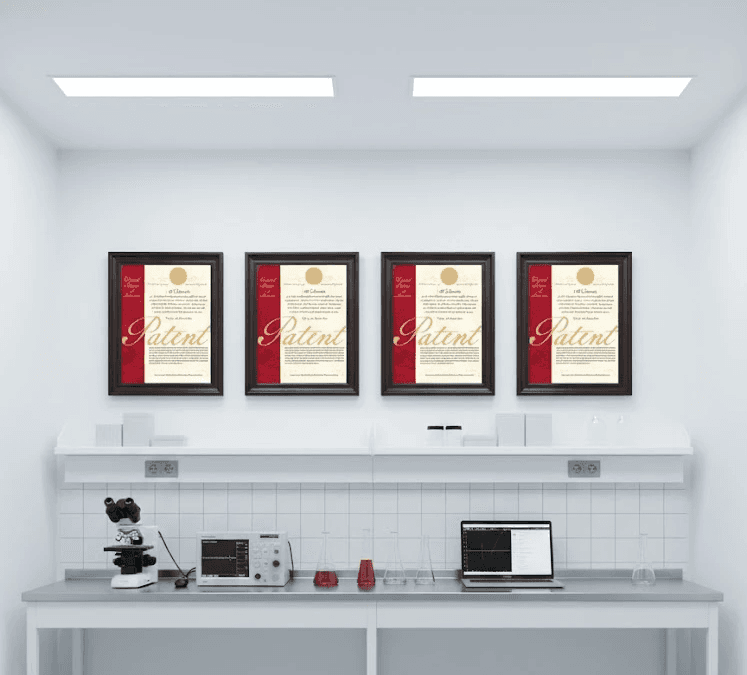 Black and white image of people working at a table with laptops, showing hands gesturing during discussion of digital content displayed on screens, with fabrica® logo in the corner.