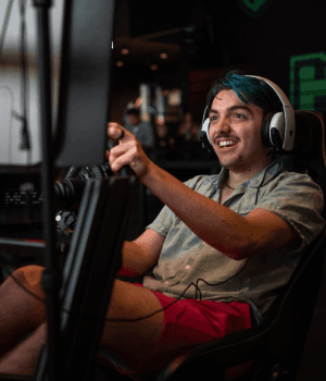 Person smiling while using the racing rigs