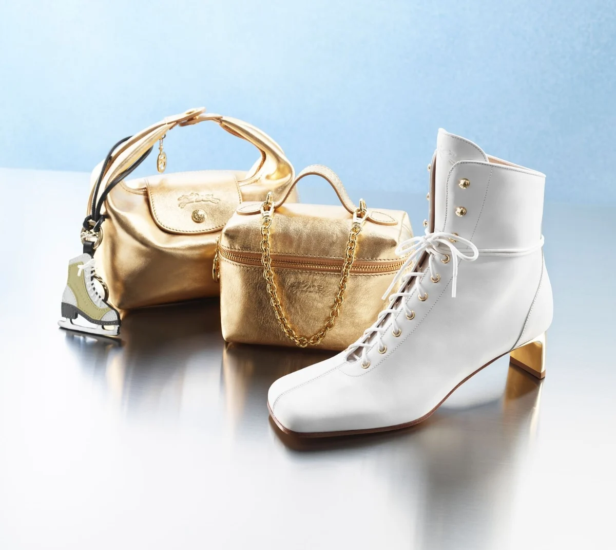 Close-up of stylish women’s chunky sneakers in soft green, beige, and orange tones, worn by a woman indoors with bright natural lighting.