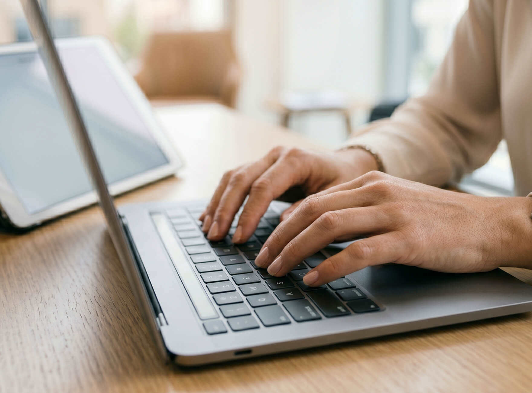 Man with a laptop walking to a store
