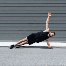 Man in gym wear doing a side plank with arm in air