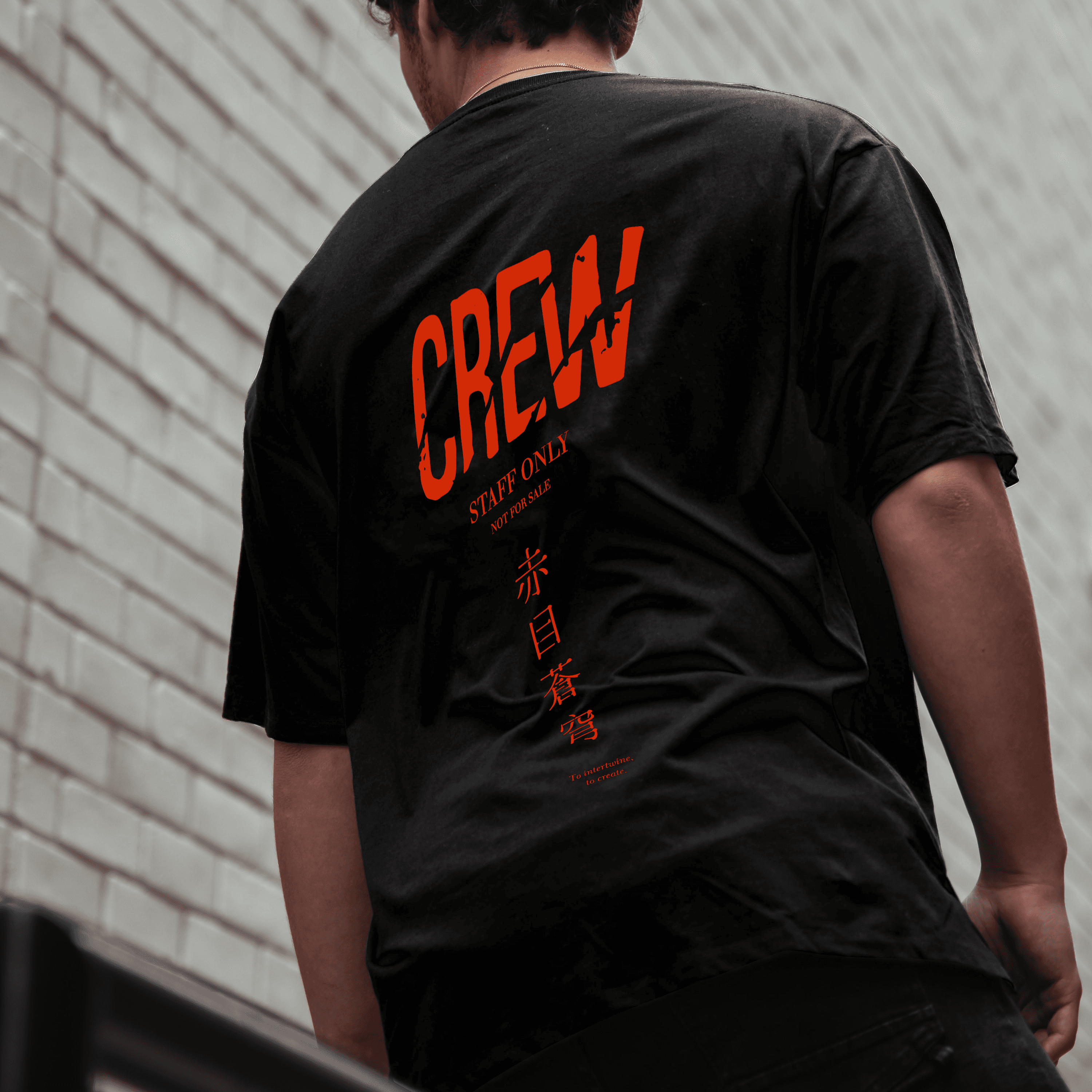 crew members at work wearing the t-shirts designed for crew members showing the design in the back