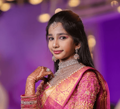 Mountain refuge illuminated at night under starry sky.