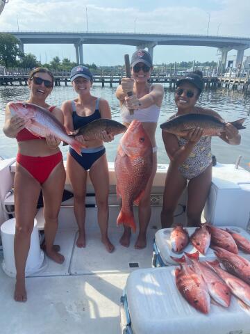 Women holding various Snappers