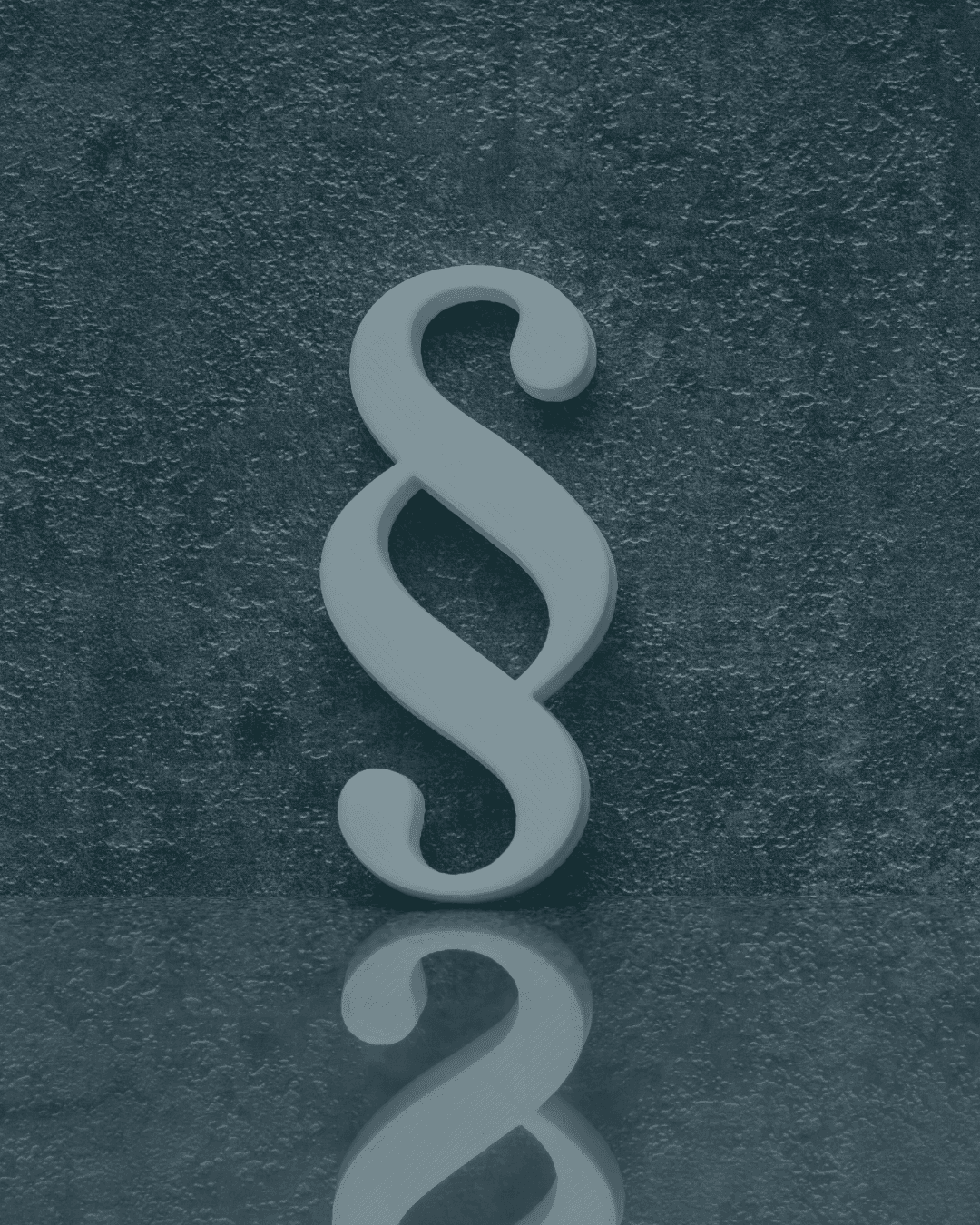 A smiling woman with her arms crossed, standing against a dark green background. She has long, dark hair.